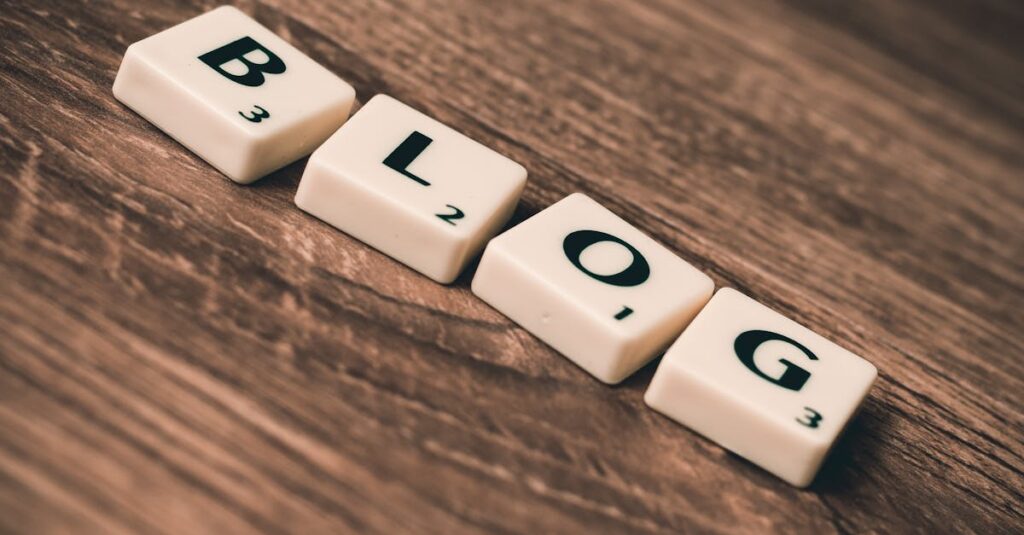 Scrabble tiles spelling 'BLOG' on a wooden background, symbolizing creativity and writing.